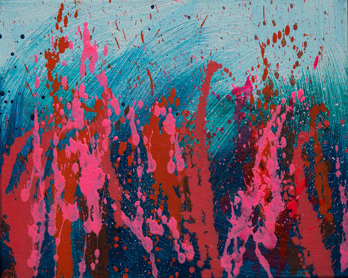 Abstract art with pink and red splashes on a blue background